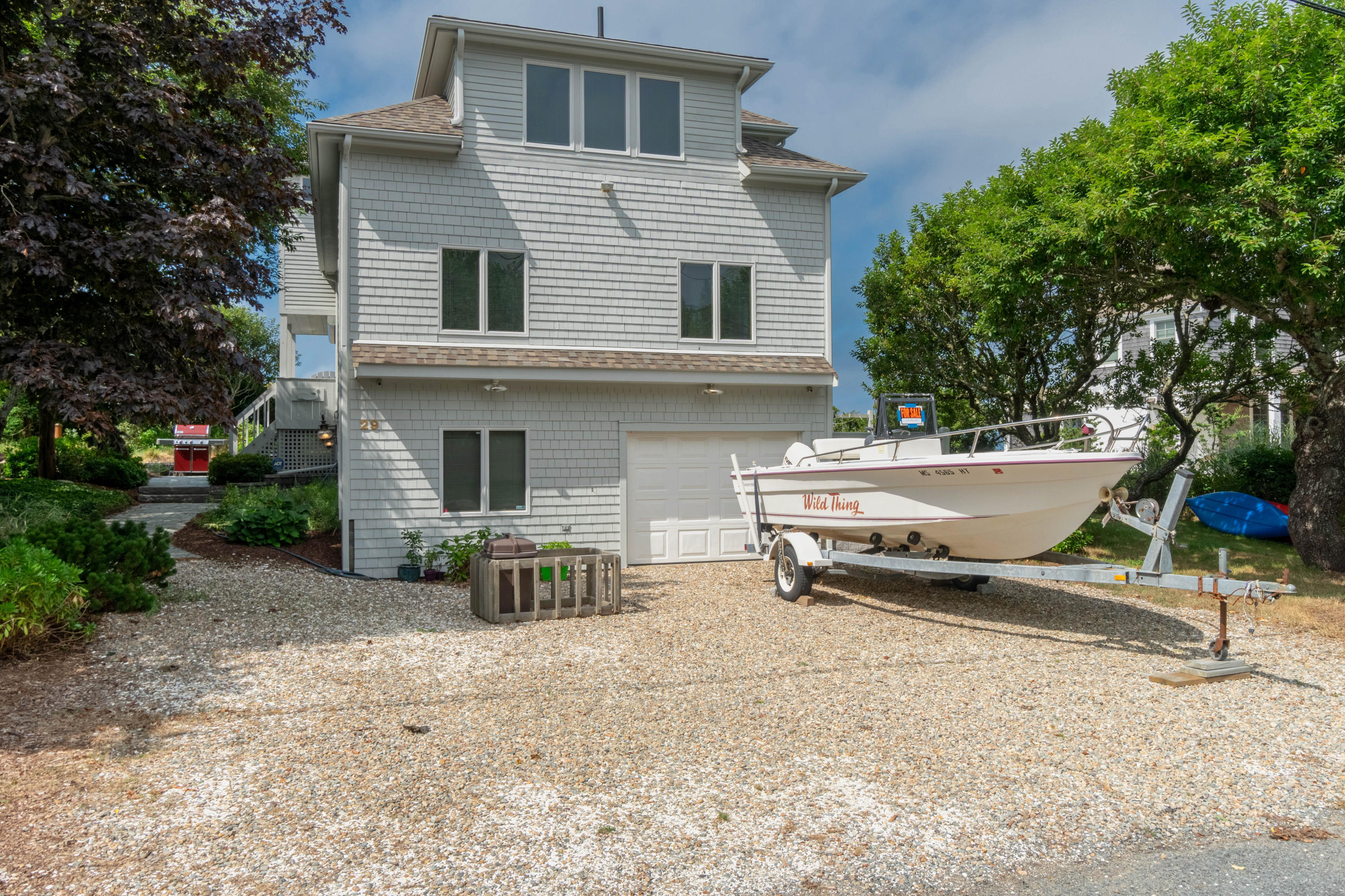 29 Bayberry Lane Eastham, MA 02642 - Photo 10 of 35 a backyard of a house with table and chairs