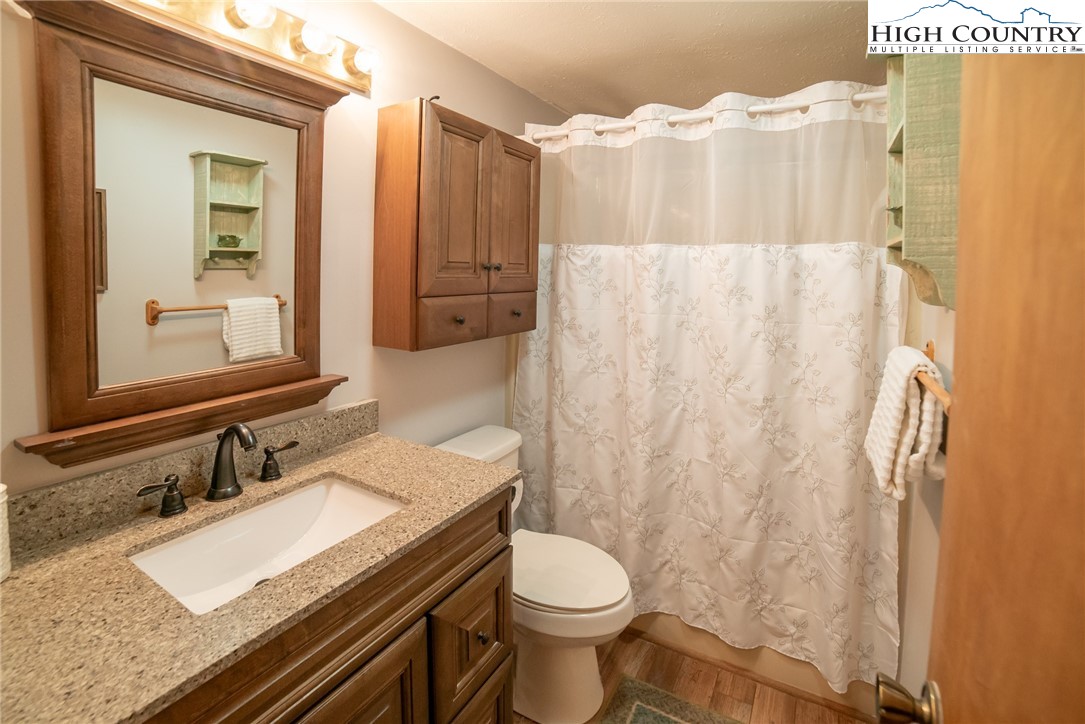 10 Locust Road Newland, NC 28657 - Photo 18 of 36 a bathroom with a sink and a mirror