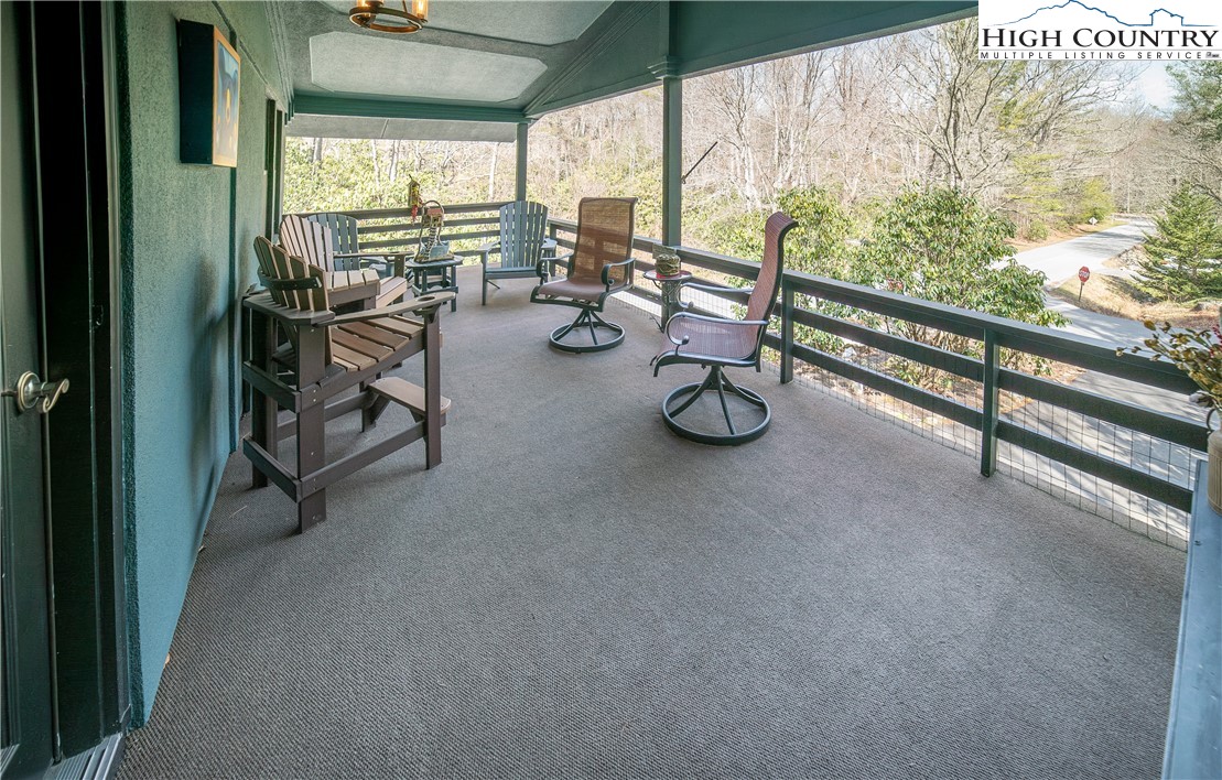10 Locust Road Newland, NC 28657 - Photo 3 of 36 a view of a room with gym equipment and floor to ceiling window