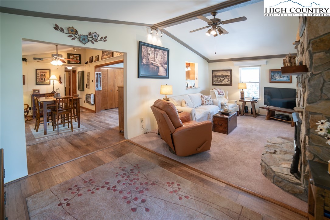 10 Locust Road Newland, NC 28657 - Photo 4 of 36 a living room with furniture a dining table and a fireplace