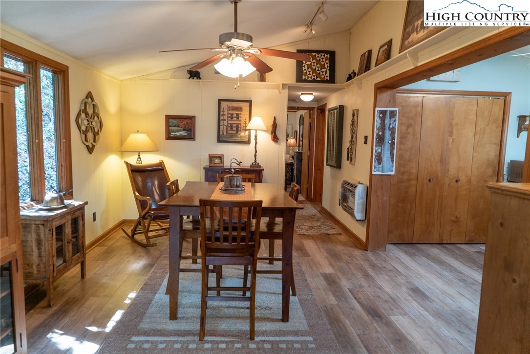 10 Locust Road Newland, NC 28657 - Photo 5 of 36 a view of a dining room with furniture window and wooden floor