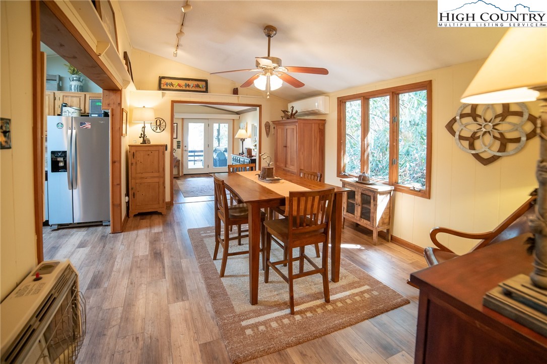 10 Locust Road Newland, NC 28657 - Photo 6 of 36 a view of a dining room with furniture window and wooden floor