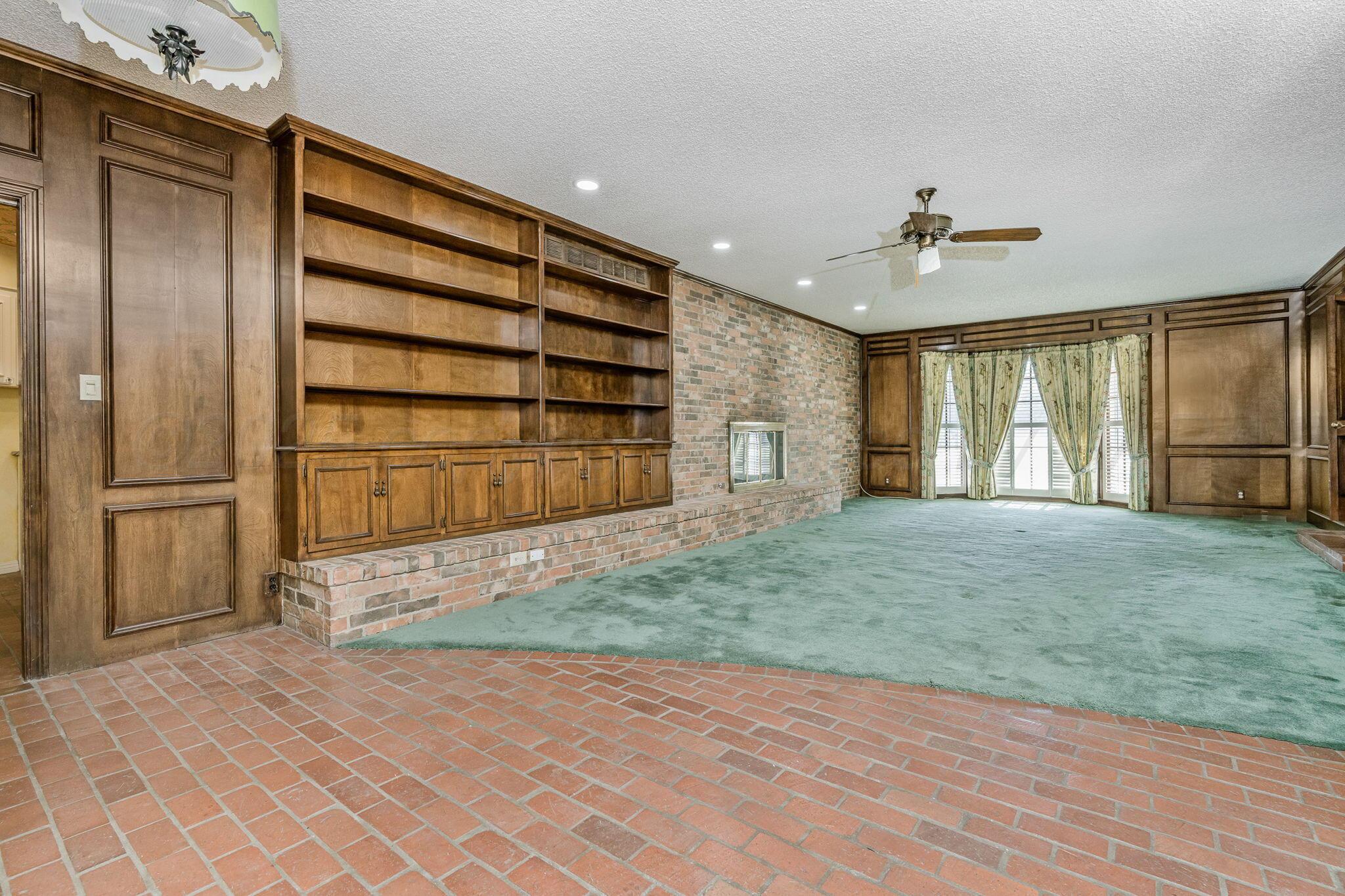 112 Western Street Claude, TX 79019 - Photo 19 of 41 a view of an empty room with a window and wooden floor