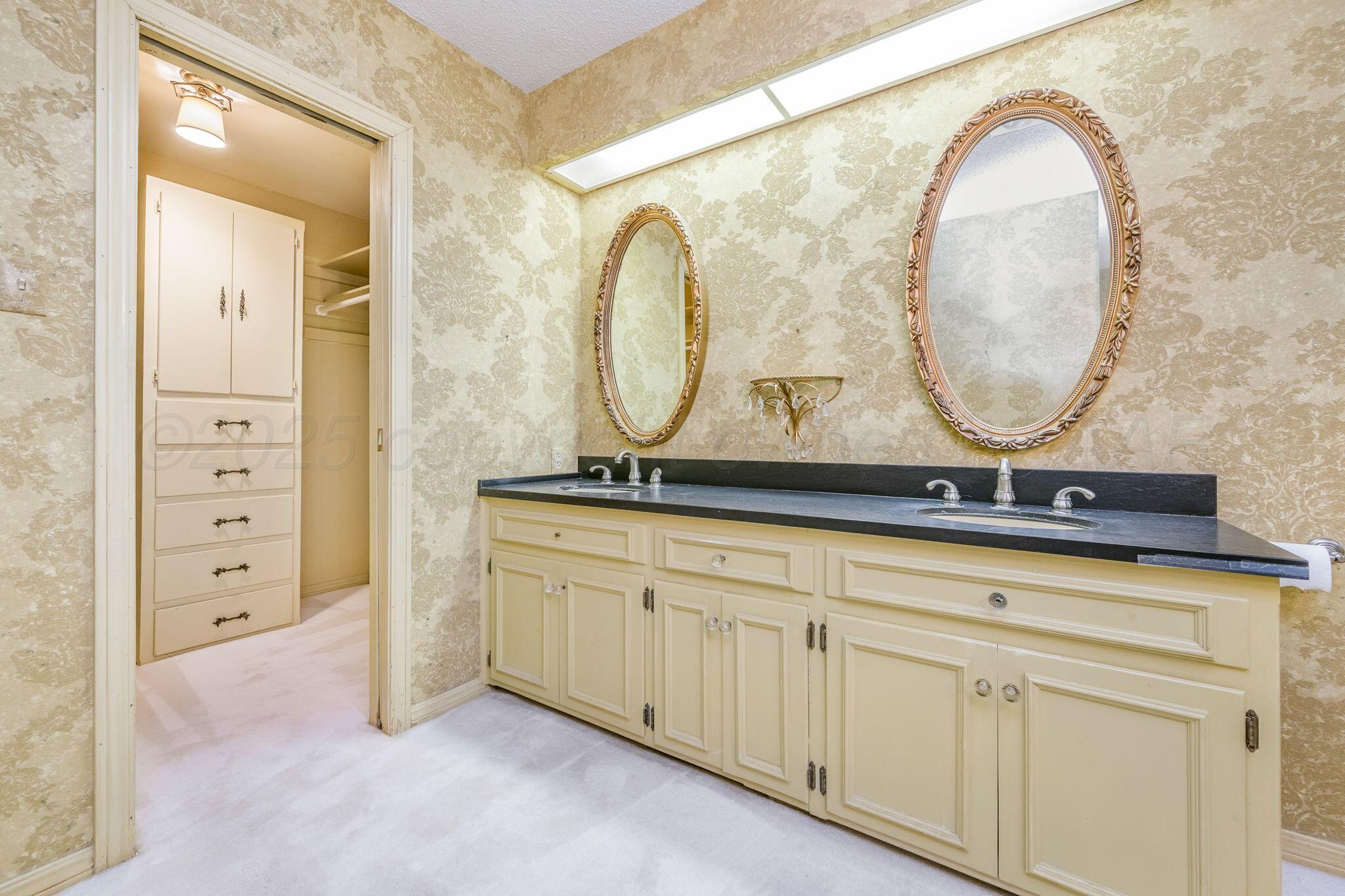 112 Western Street Claude, TX 79019 - Photo 31 of 41 a bathroom with a sink and a mirror