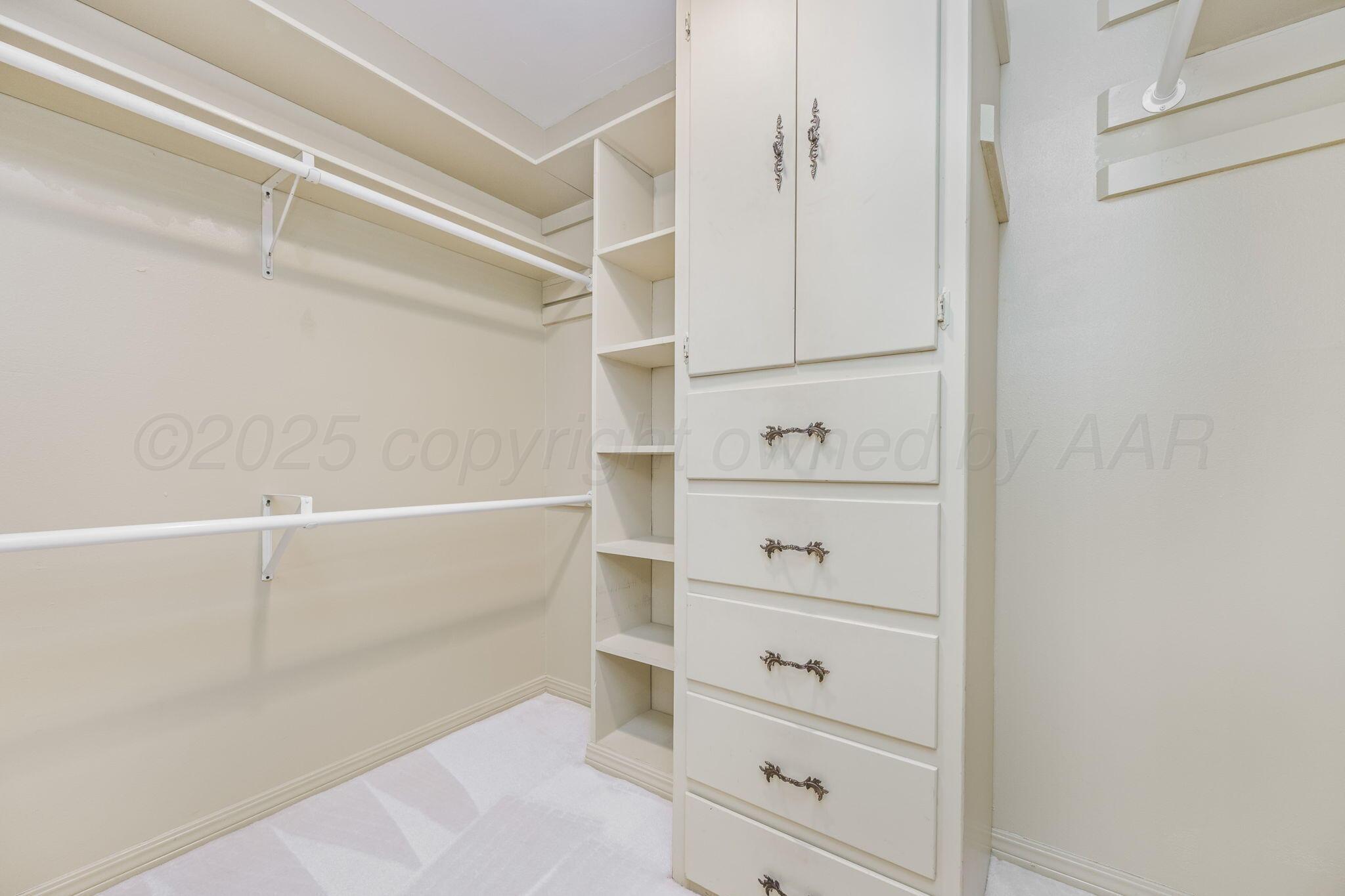 112 Western Street Claude, TX 79019 - Photo 32 of 41 a view of walk in closet with empty racks