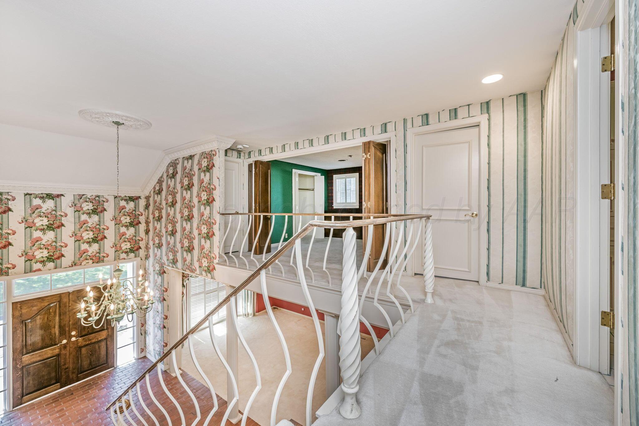112 Western Street Claude, TX 79019 - Photo 33 of 41 a view of entryway and hall with wooden floor