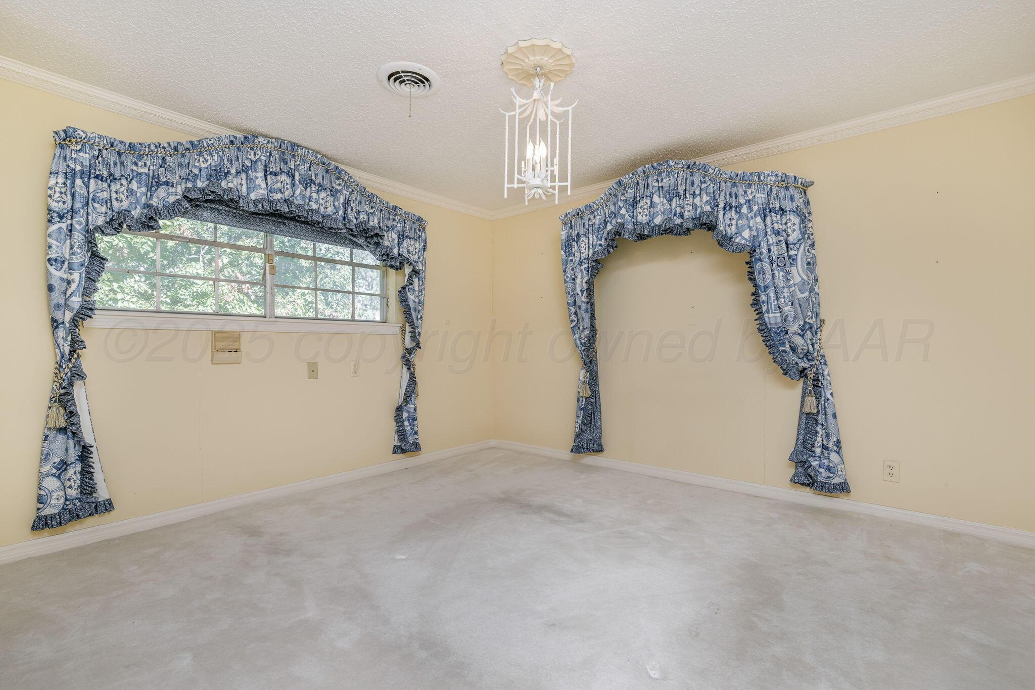 112 Western Street Claude, TX 79019 - Photo 36 of 41 a view of empty room with floor to ceiling window