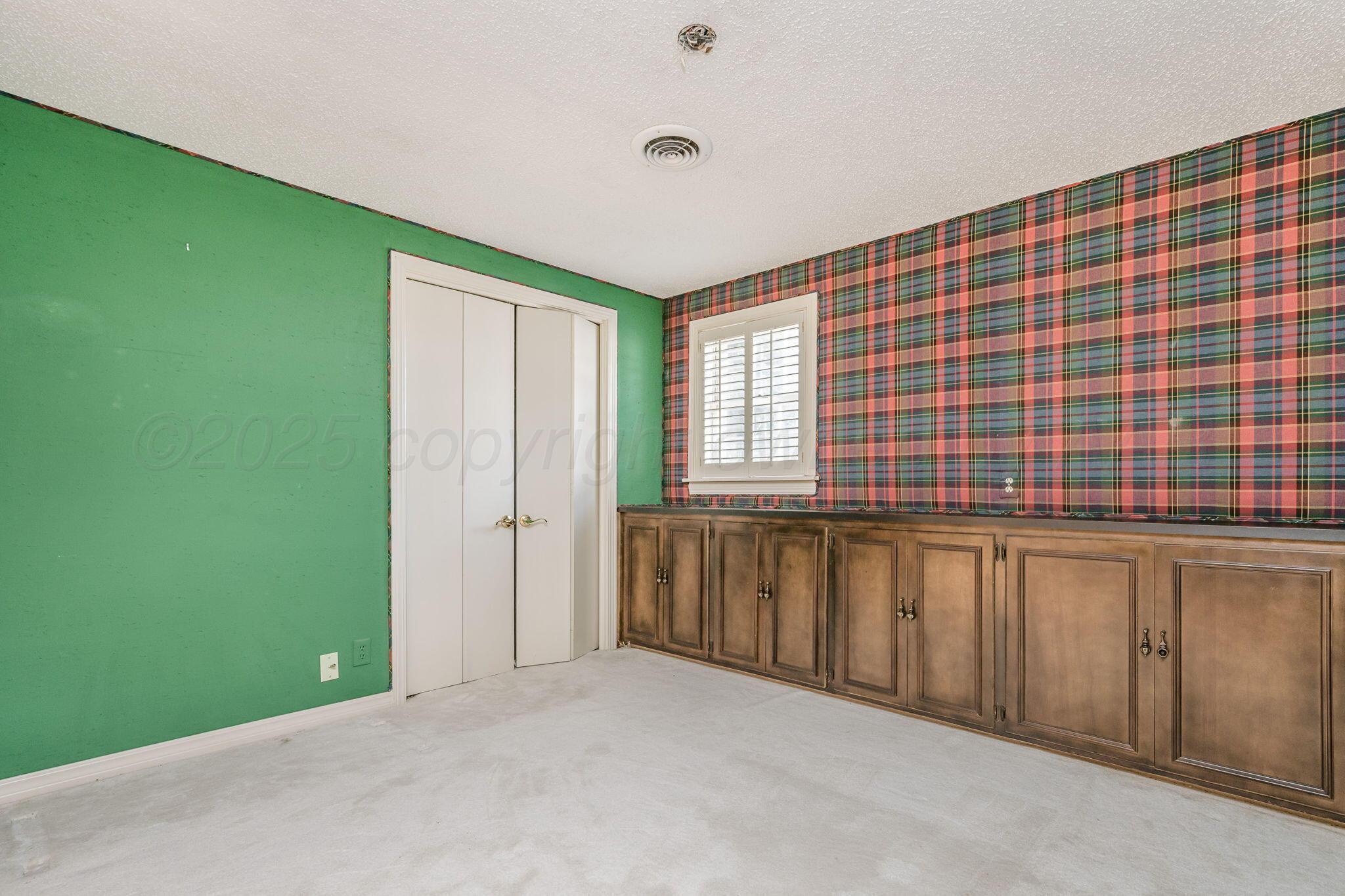 112 Western Street Claude, TX 79019 - Photo 40 of 41 a view of an empty room with a window and a kitchen