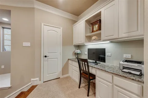 a kitchen with stainless steel appliances granite countertop a stove a microwave and a refrigerator