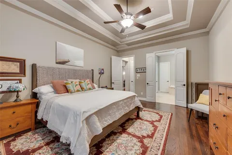 a bed room with a bed and a chandelier