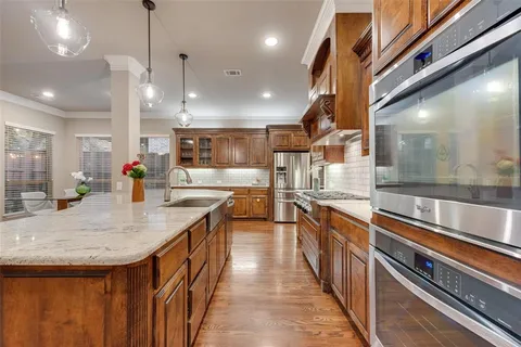 a kitchen with stainless steel appliances granite countertop lots of counter top space
