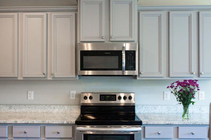 271 Wayne Trail Santa Rosa Beach, FL 32459 - Photo 13 of 42 a kitchen with stainless steel appliances granite countertop white cabinets and a stove