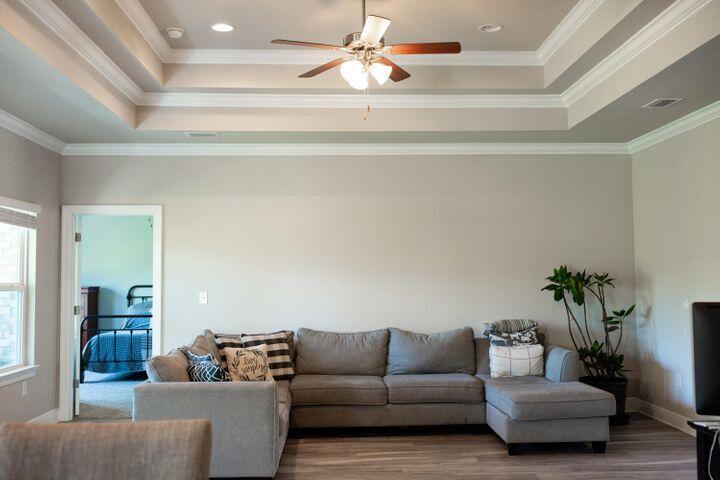 271 Wayne Trail Santa Rosa Beach, FL 32459 - Photo 7 of 42 a living room with furniture and a chandelier