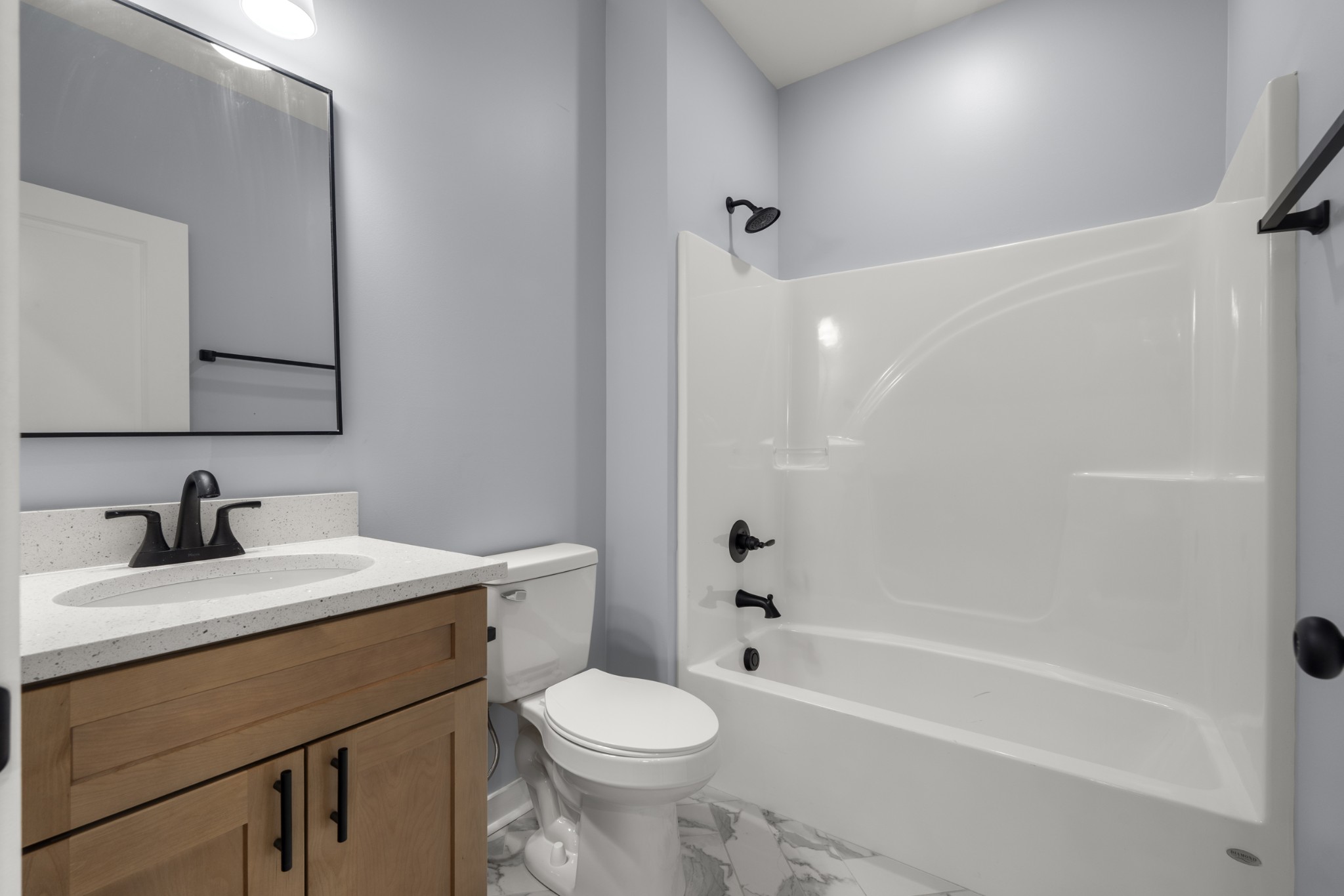 1572 Gilliam Hollow Road Dickson, TN 37055 - Photo 11 of 16 a bathroom with a sink a toilet and shower