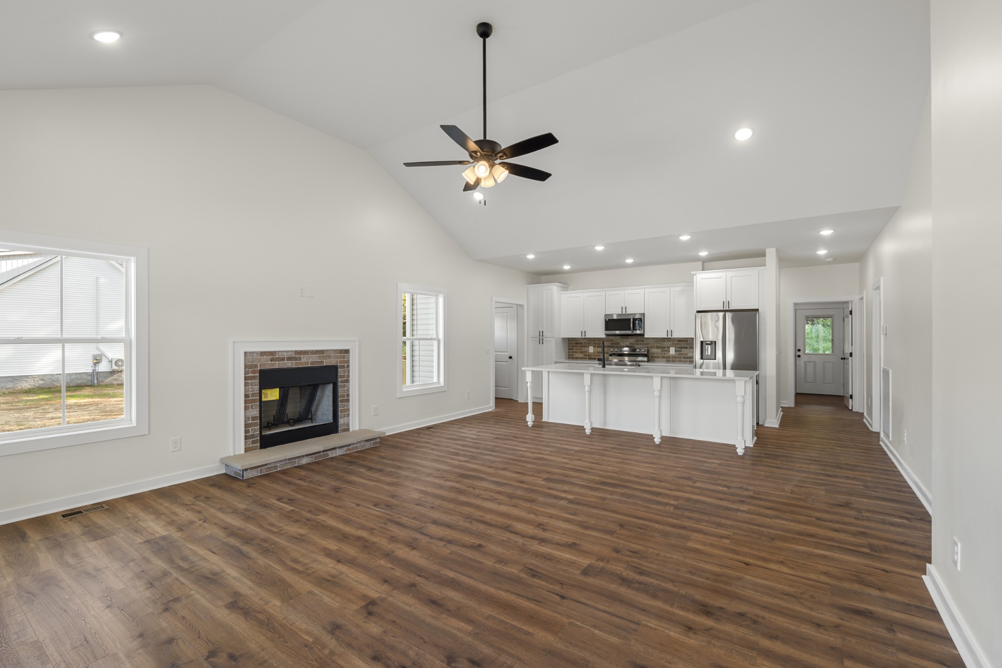 1572 Gilliam Hollow Road Dickson, TN 37055 - Photo 5 of 16 a view of an empty room with kitchen and window