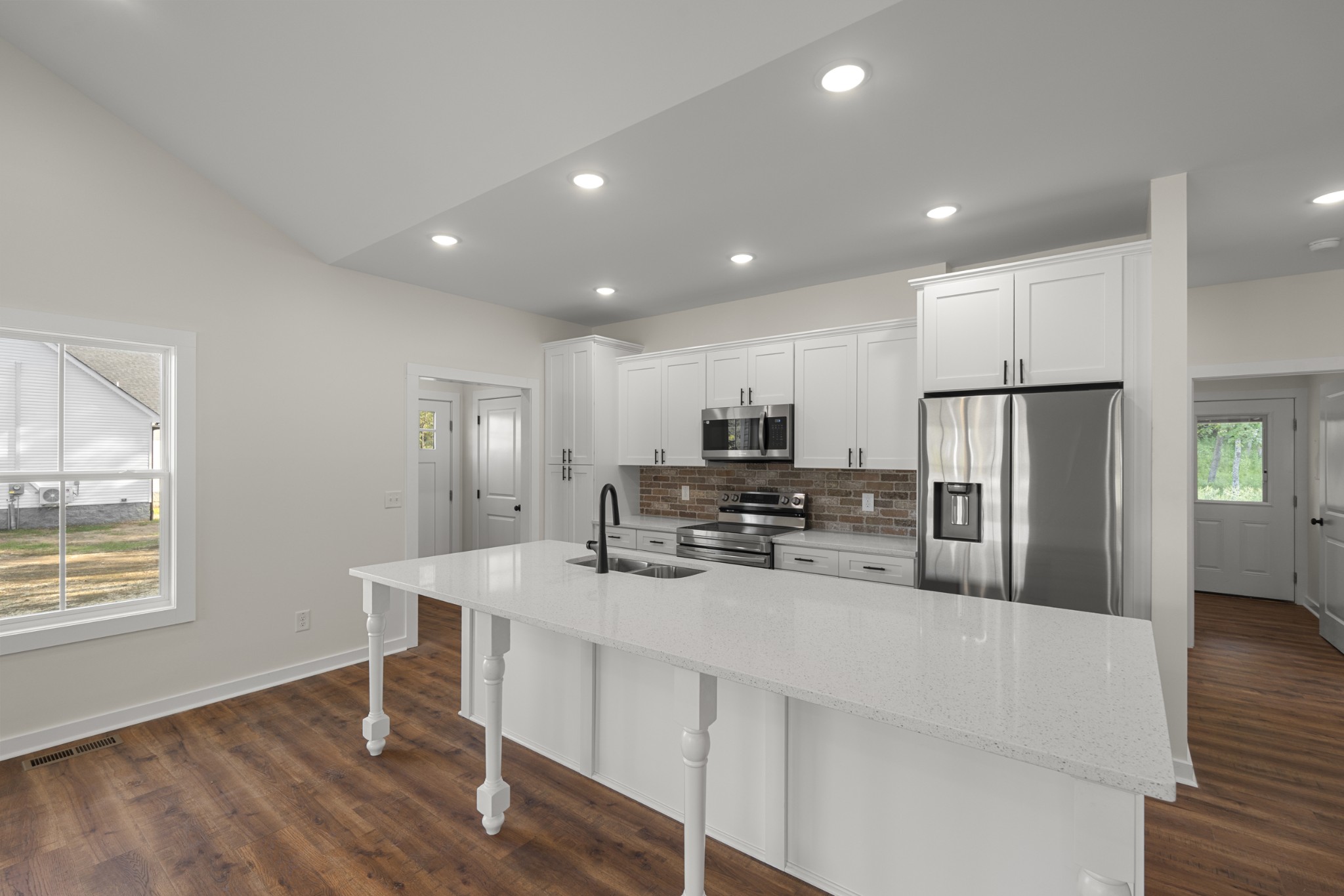 1572 Gilliam Hollow Road Dickson, TN 37055 - Photo 8 of 16 a kitchen with stainless steel appliances a refrigerator and a stove top oven