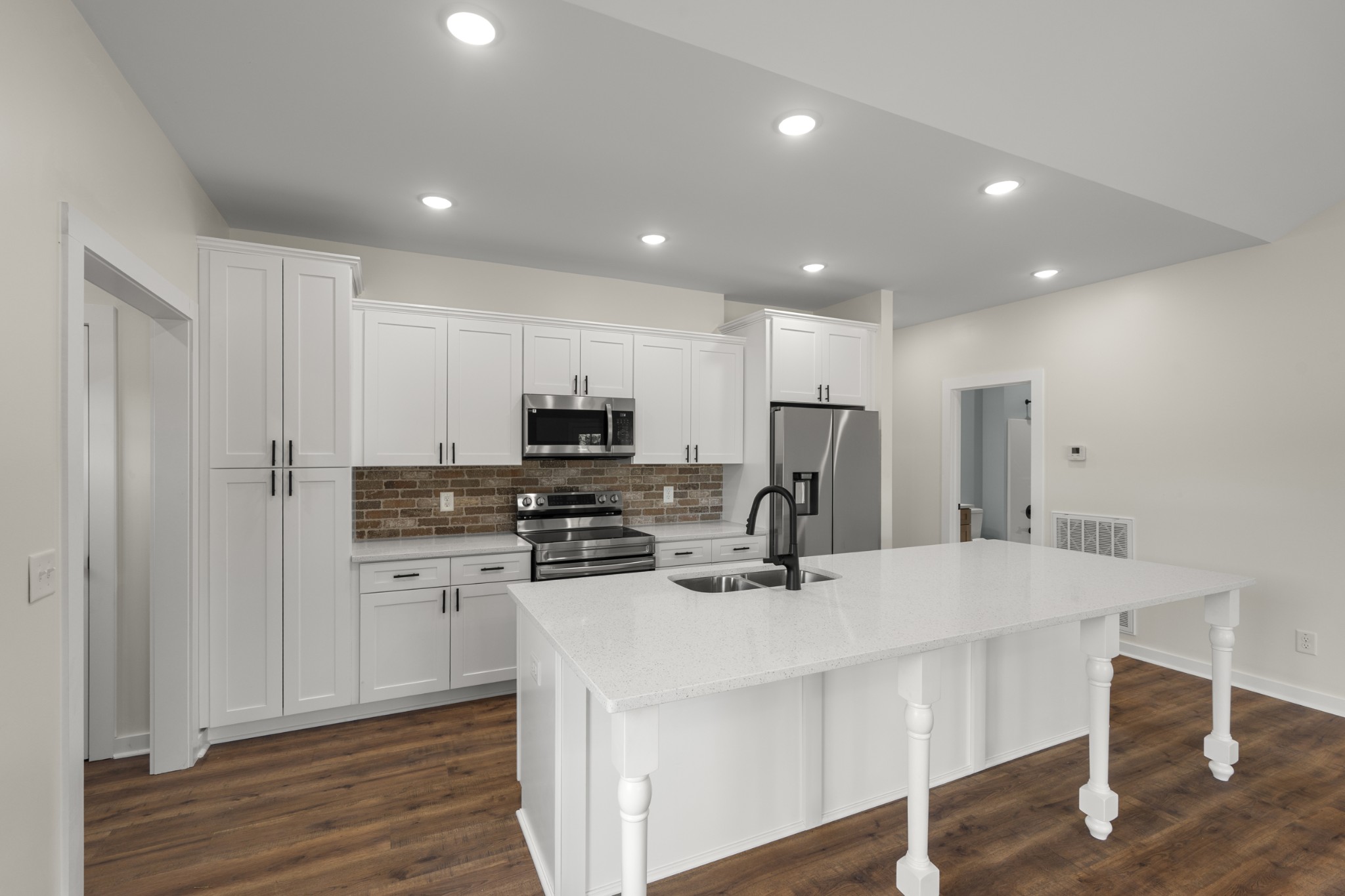 1572 Gilliam Hollow Road Dickson, TN 37055 - Photo 9 of 16 a kitchen with stainless steel appliances a refrigerator and a stove top oven