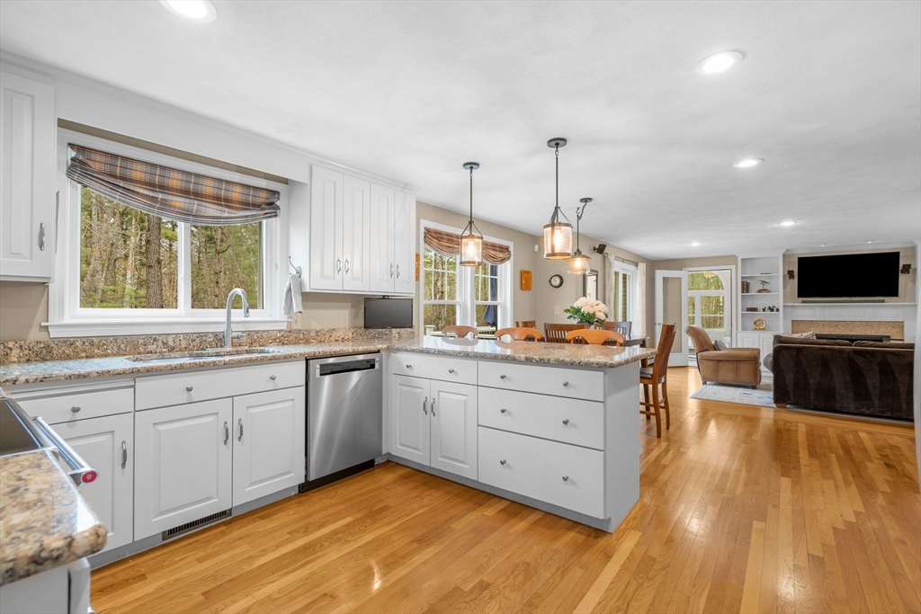 14 Hunters Road Boxford, MA 01921 - Photo 13 of 42 a large kitchen with cabinets wooden floor and stainless steel appliances