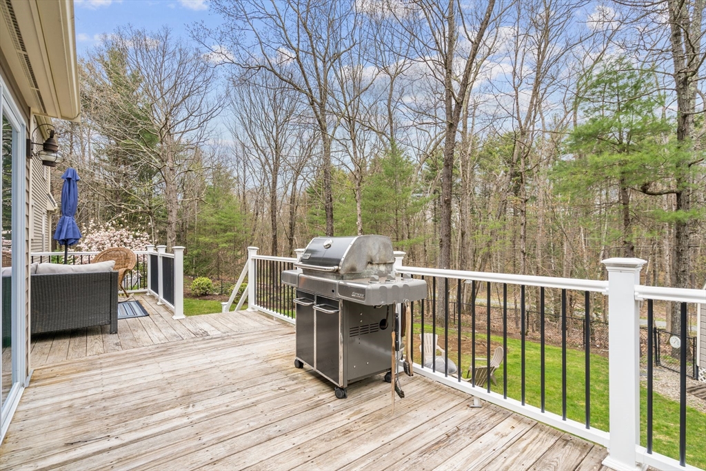 14 Hunters Road Boxford, MA 01921 - Photo 24 of 42 a view of a deck with chairs and wooden floor