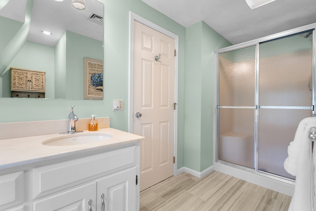 14 Hunters Road Boxford, MA 01921 - Photo 28 of 42 a bathroom with a sink and a mirror
