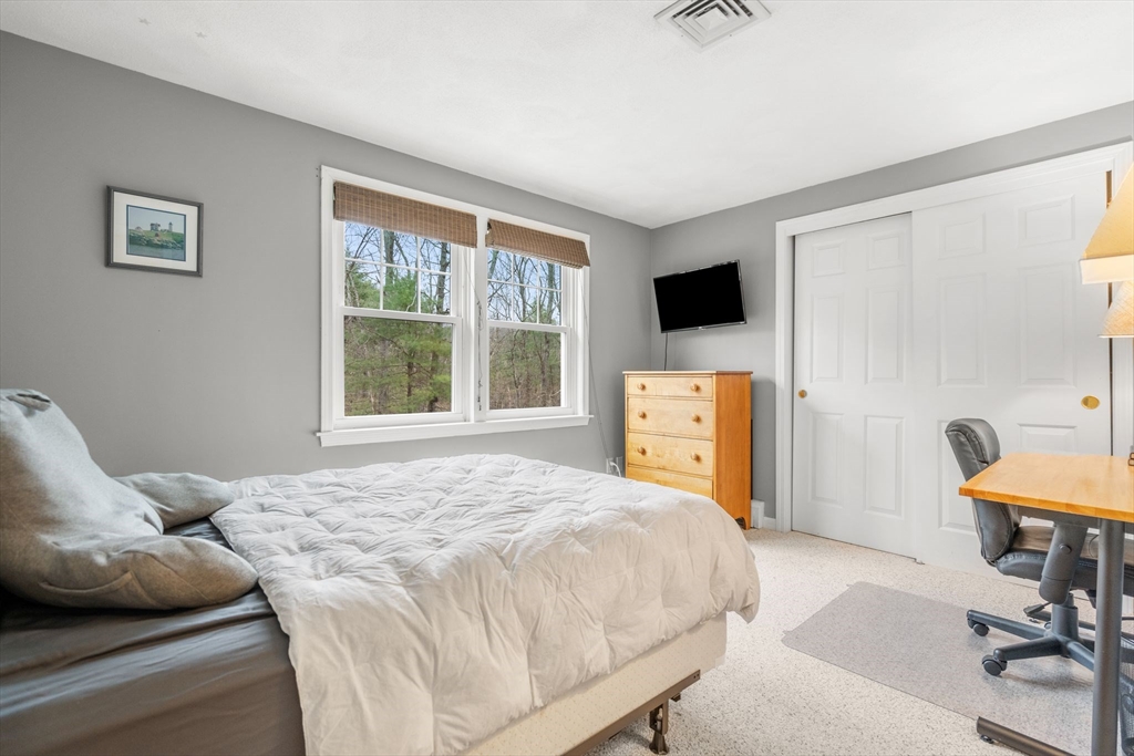 14 Hunters Road Boxford, MA 01921 - Photo 30 of 42 a bedroom with a bed and a television