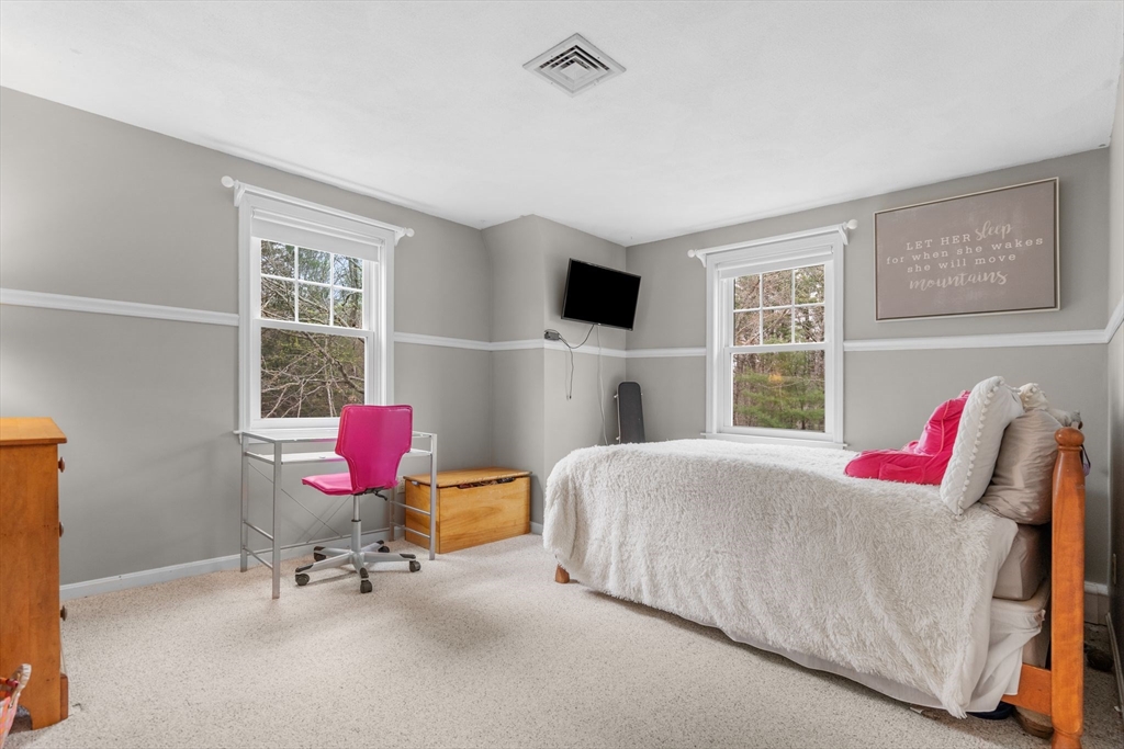 14 Hunters Road Boxford, MA 01921 - Photo 31 of 42 a bedroom with a bed and a flat screen tv