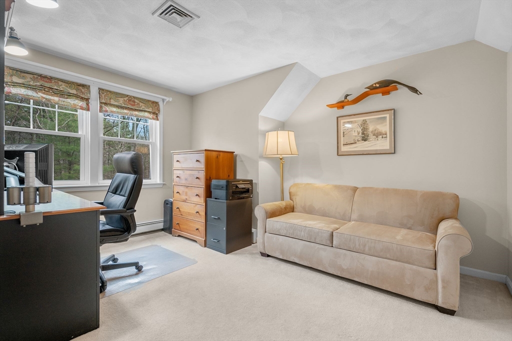 14 Hunters Road Boxford, MA 01921 - Photo 32 of 42 a living room with furniture and a flat screen tv