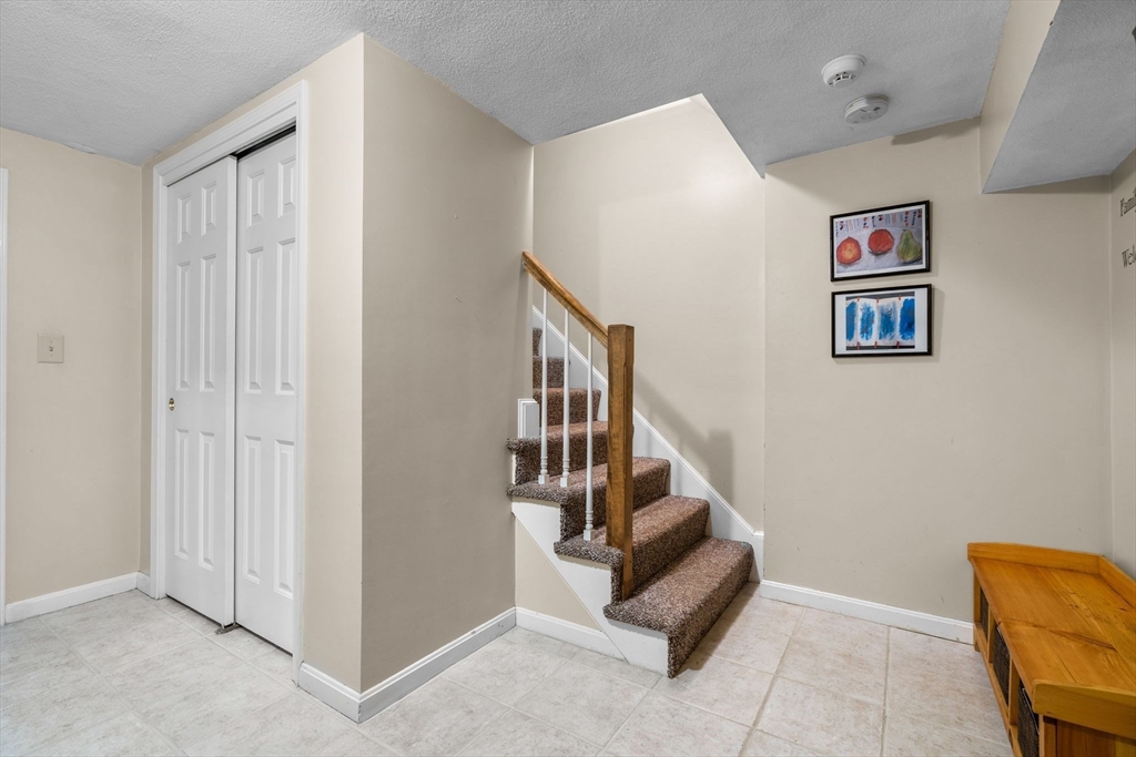 14 Hunters Road Boxford, MA 01921 - Photo 36 of 42 a view of entryway with stairs and couch