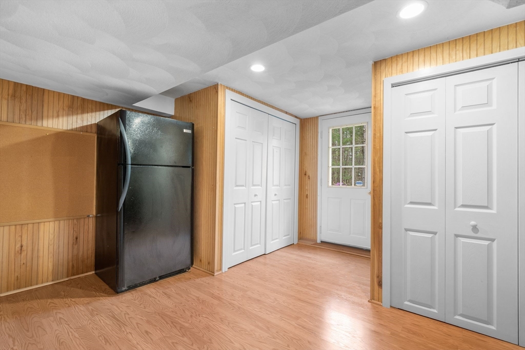 14 Hunters Road Boxford, MA 01921 - Photo 37 of 42 a view of empty room with wooden floor and cabinet