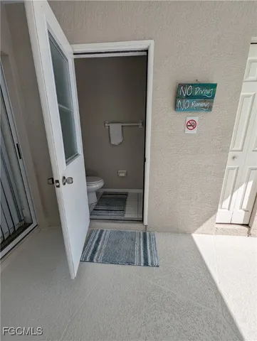 a view of a hallway with a washer and dryer