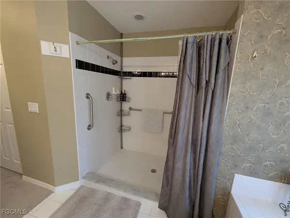 a bathroom with a shower and a toilet