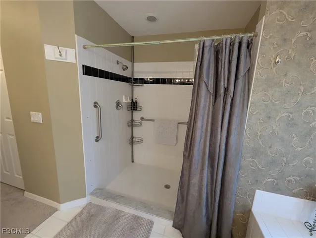 a bathroom with a shower and a toilet