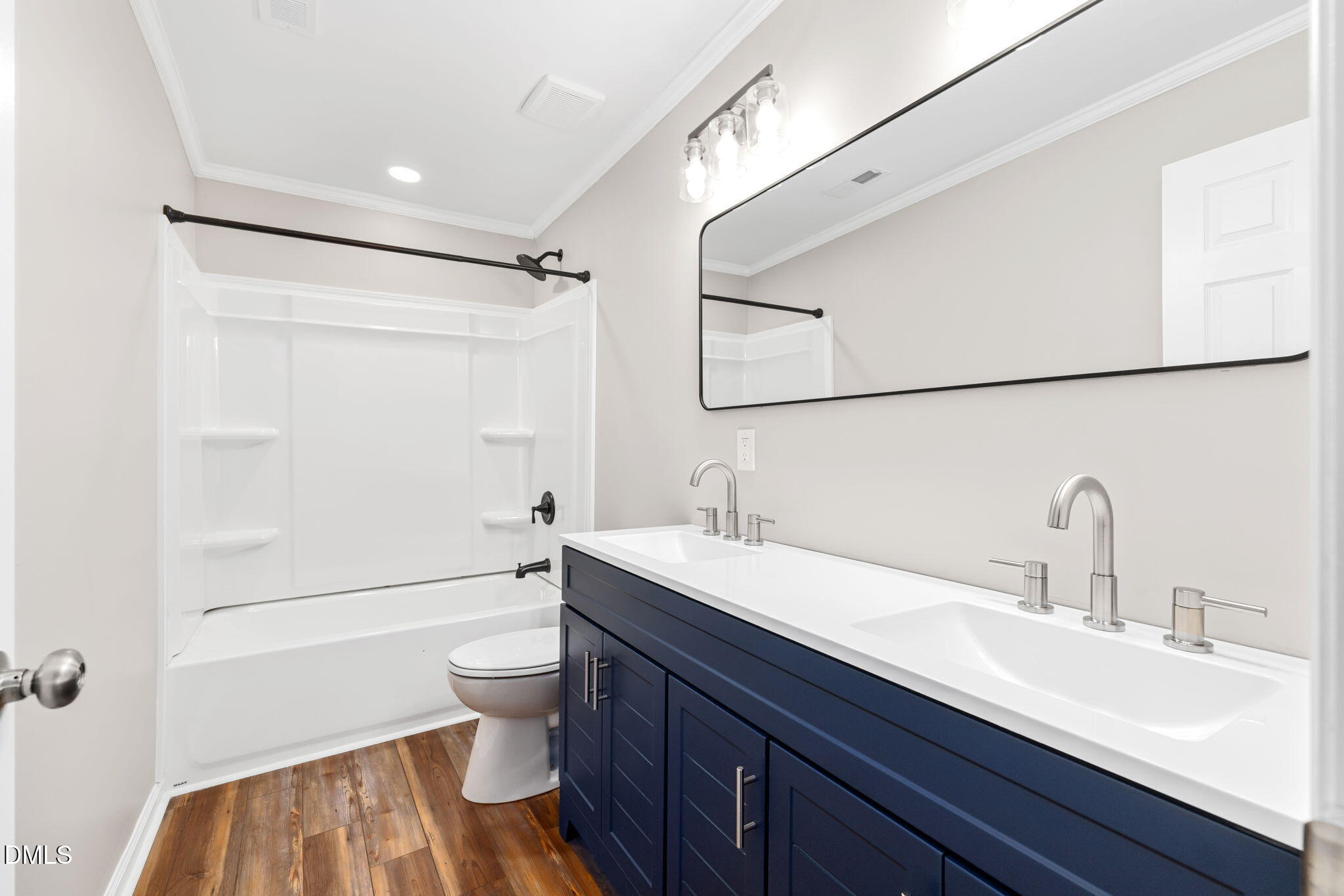 426 Rooker Dairy Road Norlina, NC 27563 - Photo 19 of 33 a bathroom with a sink a toilet and shower