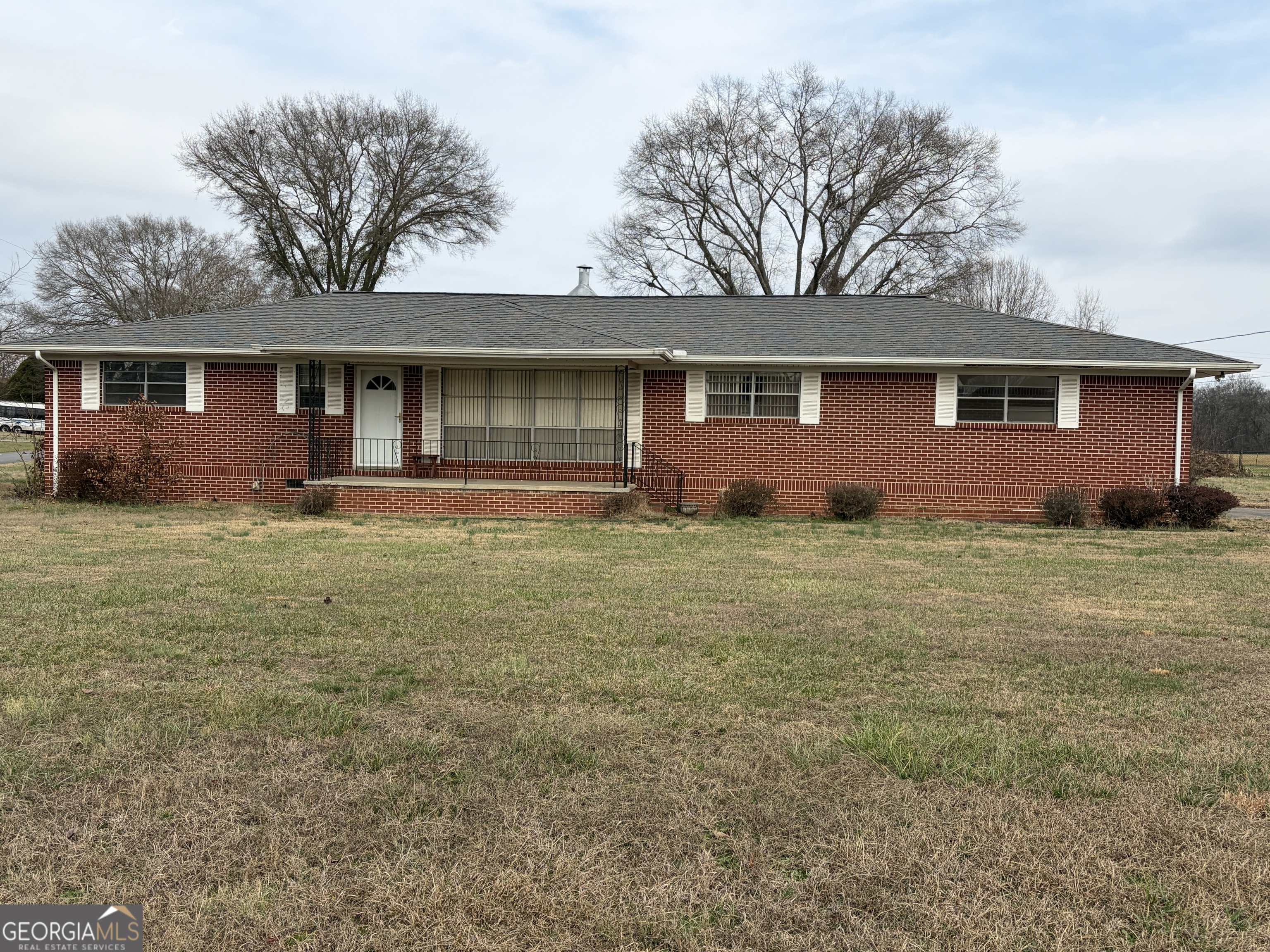 310 McDaniel Station Road Southwest Calhoun, GA 30701 - Photo 2 of 11 front view of a house with yard