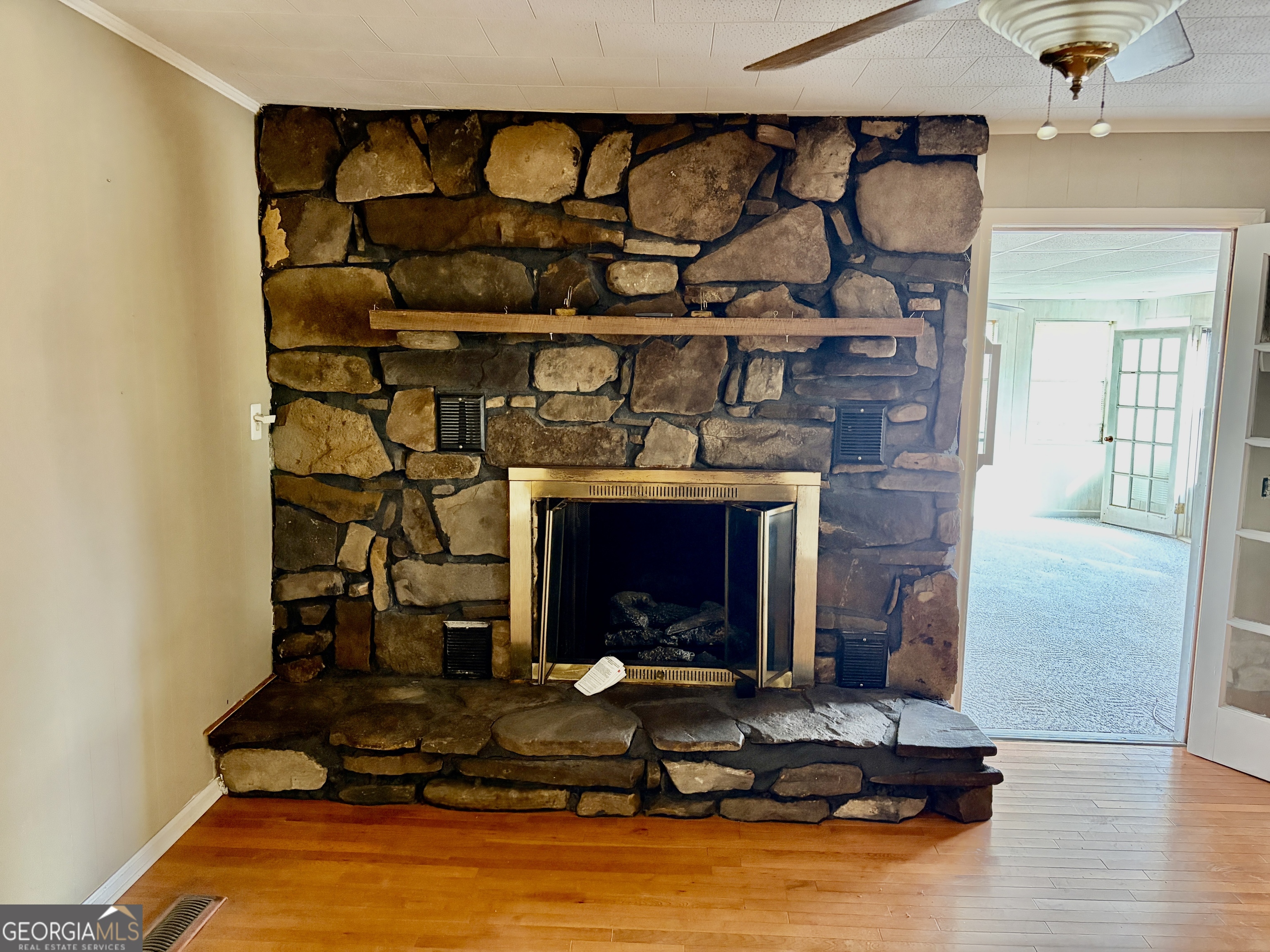 310 McDaniel Station Road Southwest Calhoun, GA 30701 - Photo 6 of 11 a living room with furniture and a fireplace