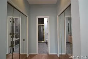 a view of a bathroom from a hallway