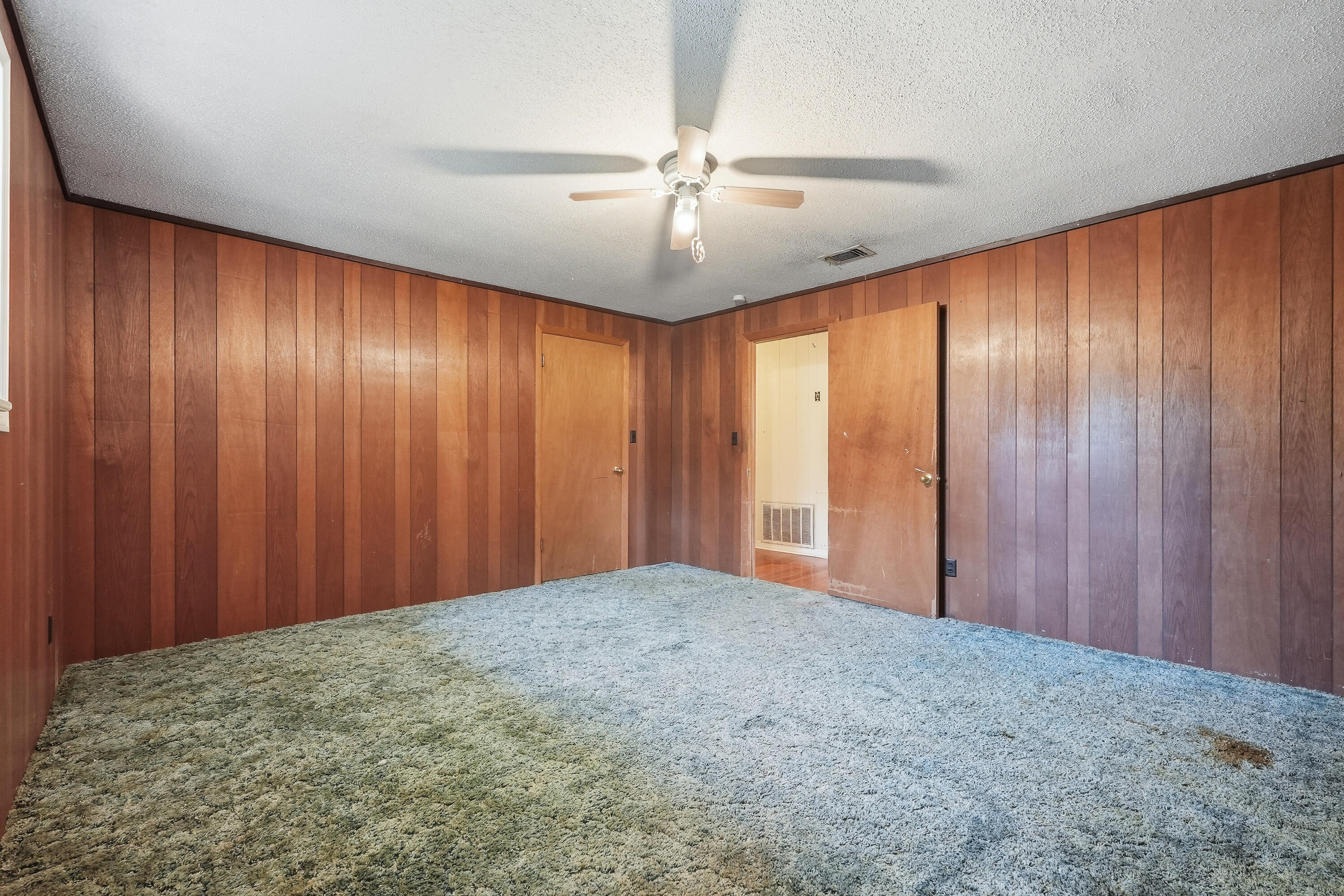 4758 Boutwell Road Laurel Hill, FL 32567 - Photo 13 of 20 wooden floor in an empty room and a window