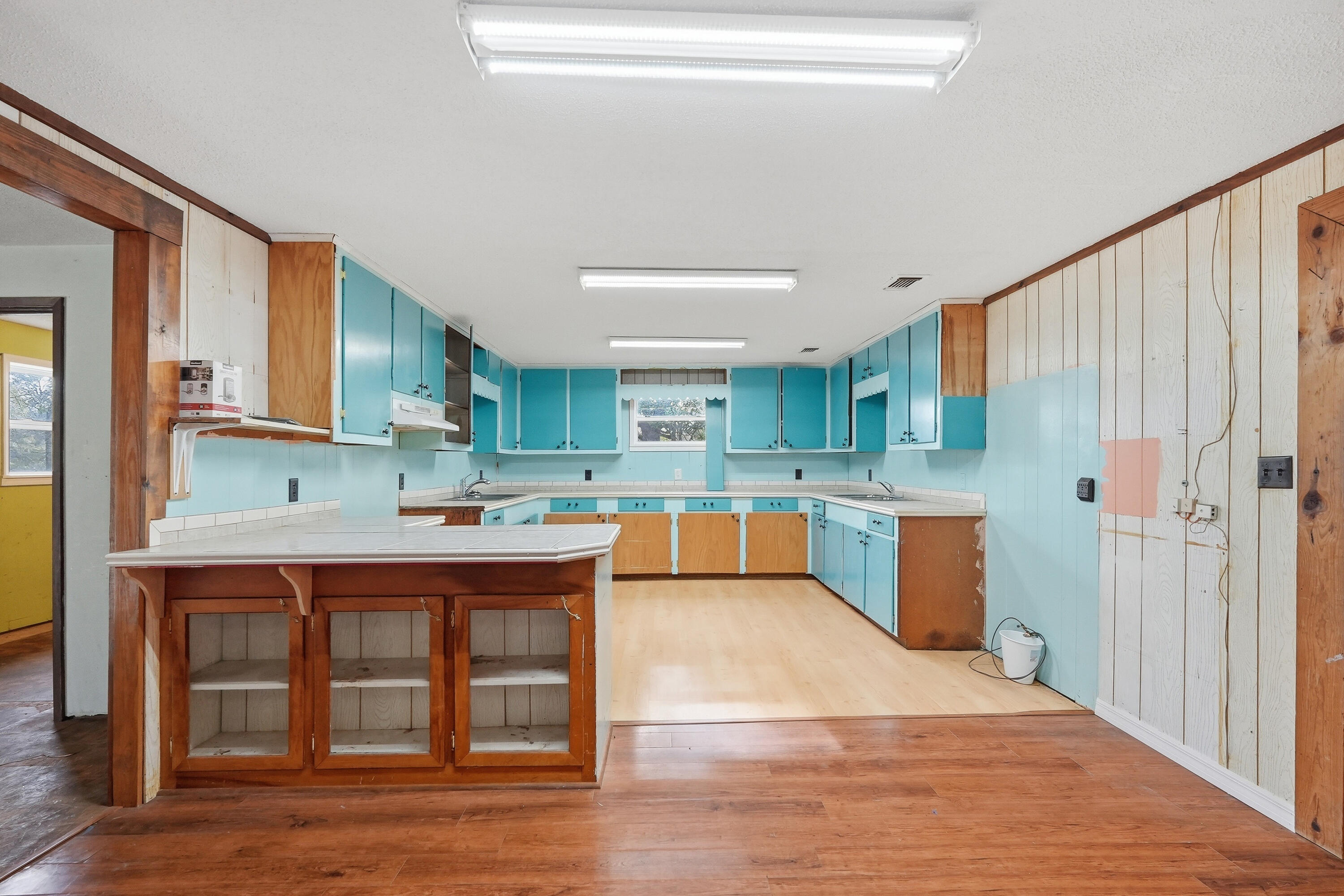 4758 Boutwell Road Laurel Hill, FL 32567 - Photo 9 of 20 a kitchen with stainless steel appliances granite countertop a sink cabinets and wooden floor