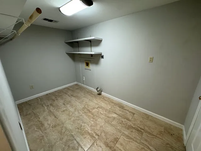 an empty room with a workbench