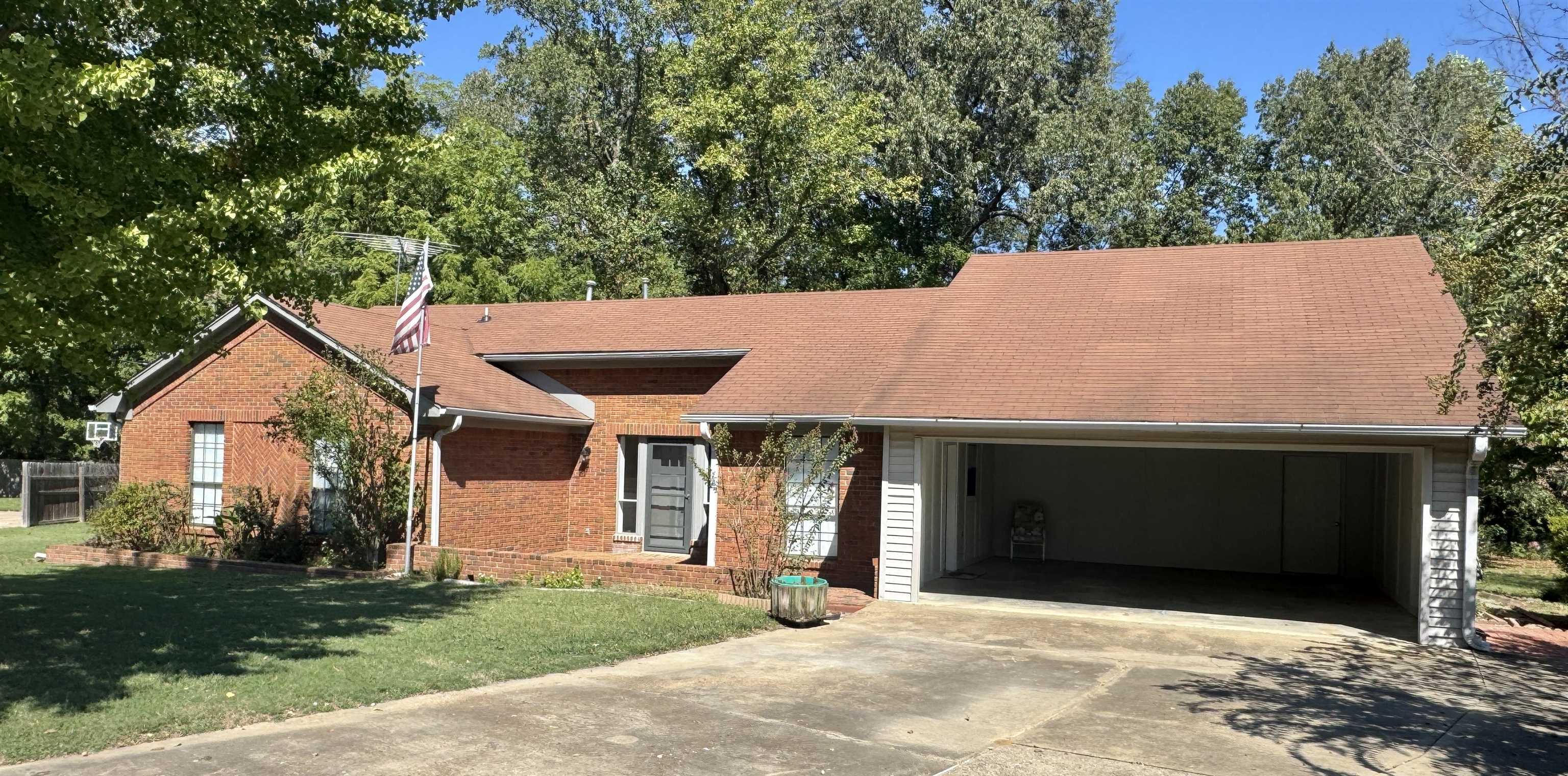 610 Hanna Drive Ripley, TN 38063 - Photo 22 of 23 a front view of a house with a yard and garage