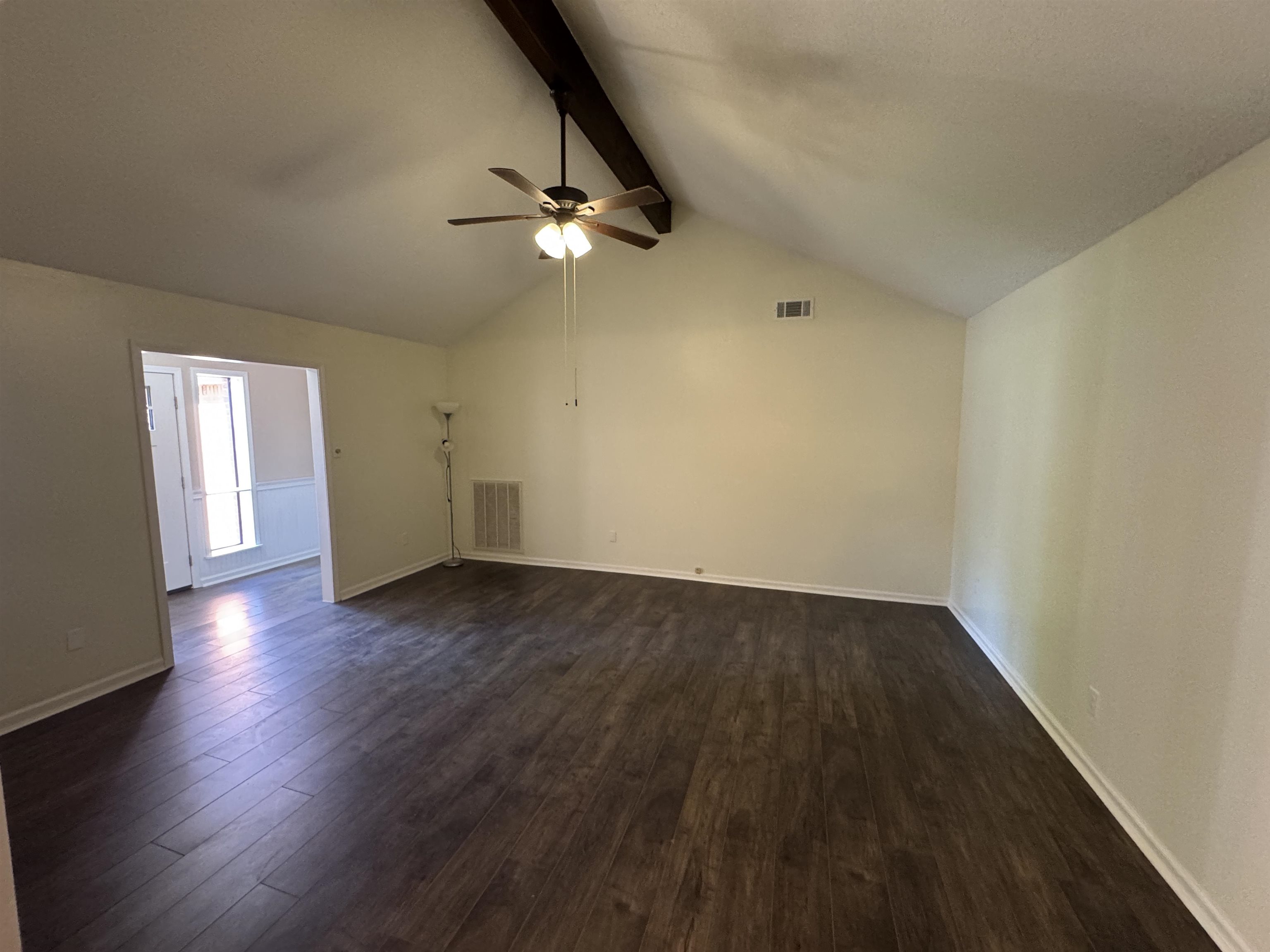 610 Hanna Drive Ripley, TN 38063 - Photo 10 of 23 an empty room with wooden floor and windows