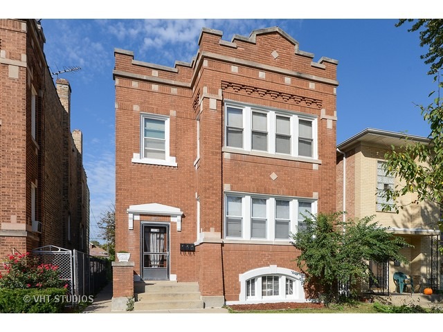 5110 West Roscoe Street Chicago, IL 60641 - Photo 1 of 10 a front view of a building