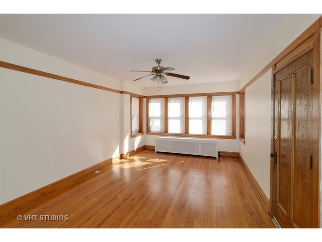 5110 West Roscoe Street Chicago, IL 60641 - Photo 2 of 10 a view of an empty room with a window