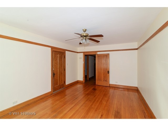 5110 West Roscoe Street Chicago, IL 60641 - Photo 3 of 10 a view of an empty room with a window