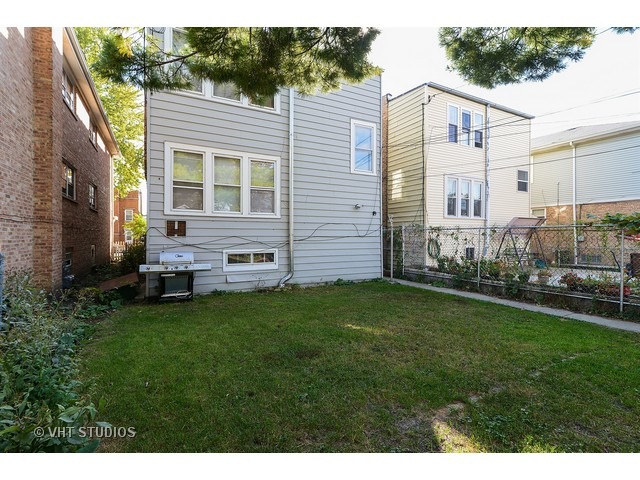 5110 West Roscoe Street Chicago, IL 60641 - Photo 10 of 10 a view of a house with a backyard