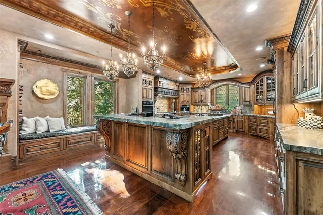 a kitchen with stainless steel appliances granite countertop a stove and a refrigerator