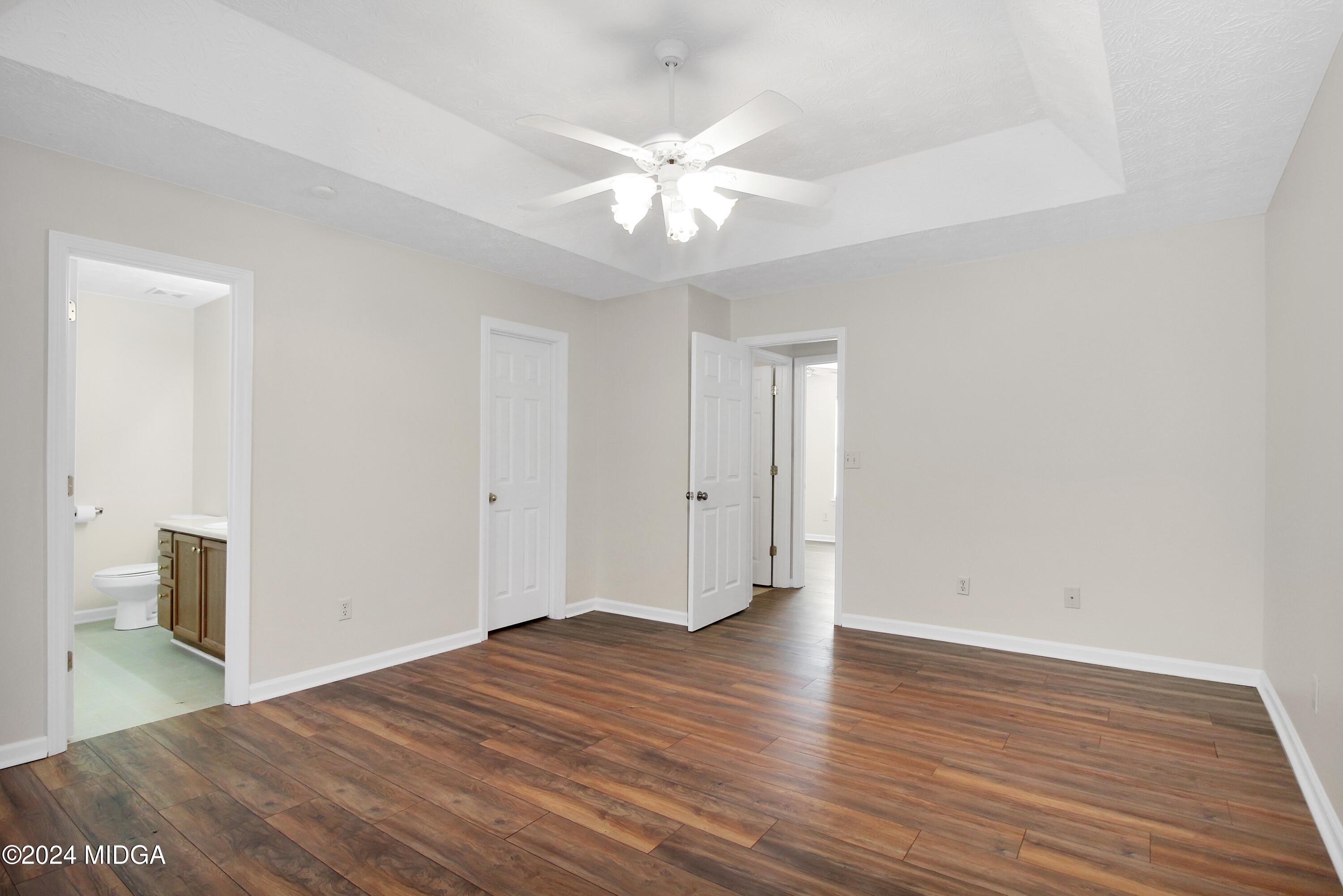 106 Meadow View Drive Jackson, GA 30233 - Photo 19 of 40 a view of a room with wooden floor and ceiling fan
