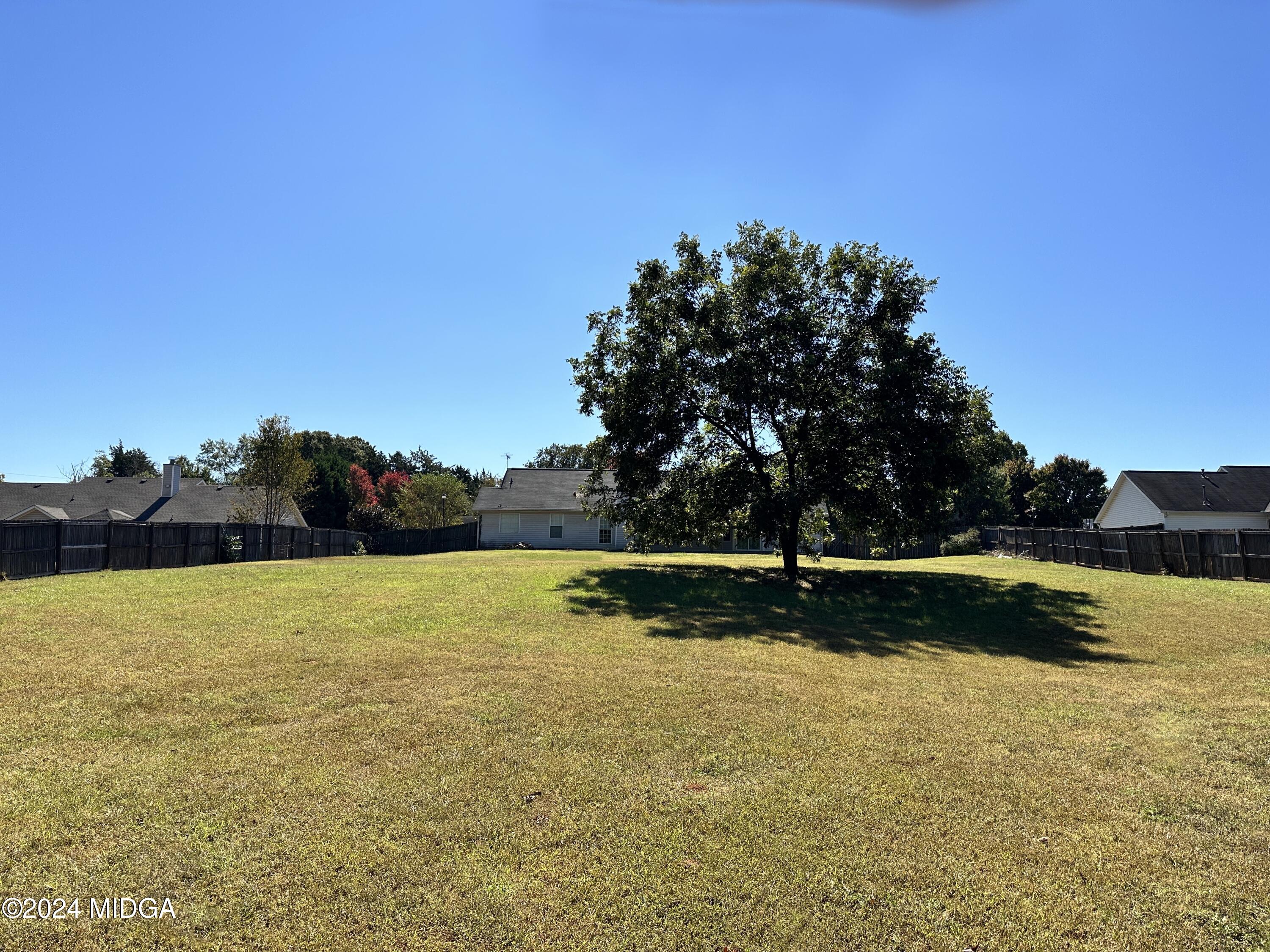 106 Meadow View Drive Jackson, GA 30233 - Photo 31 of 40 a view of an ocean beach and a yard