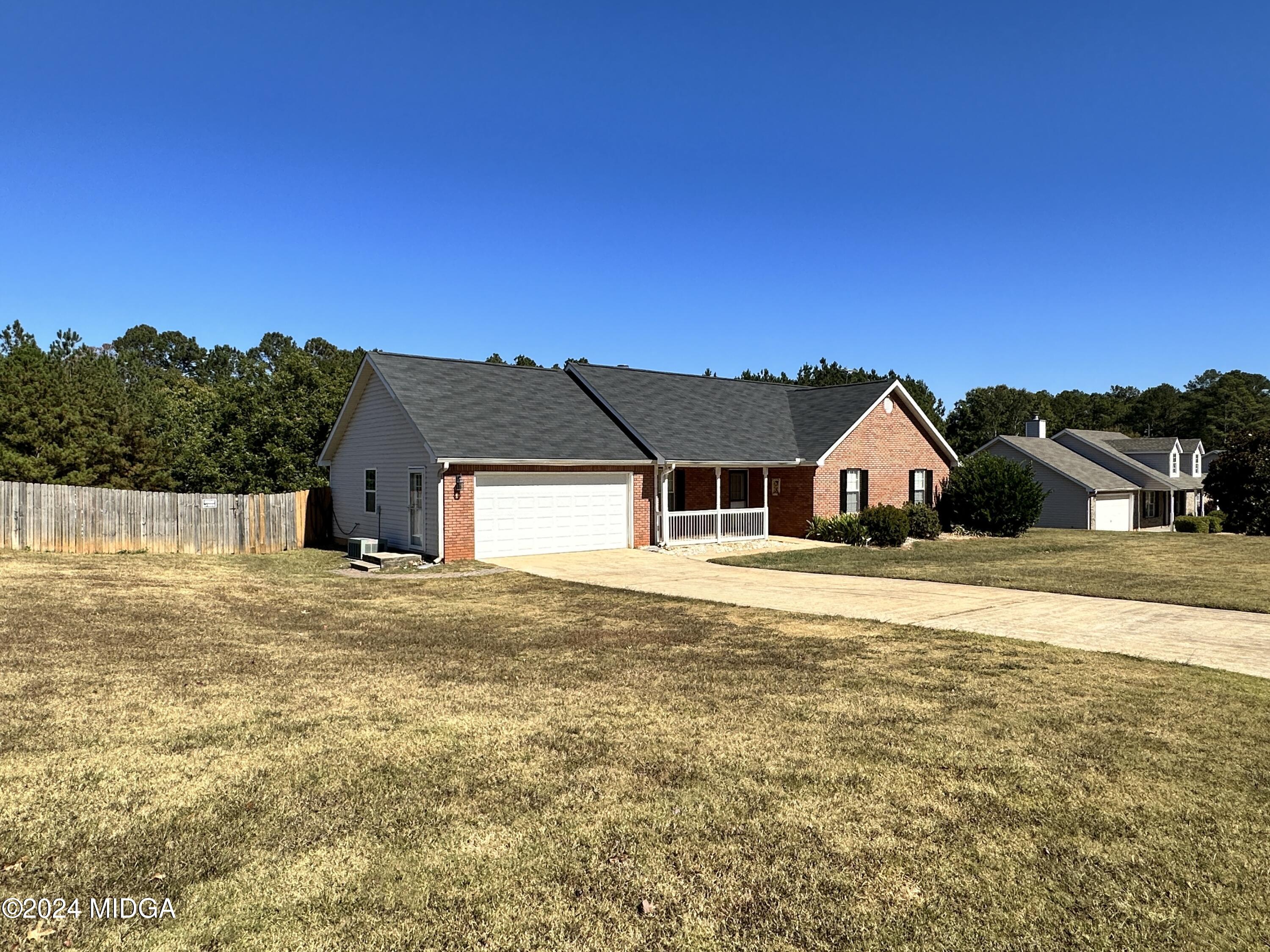 106 Meadow View Drive Jackson, GA 30233 - Photo 38 of 40 a view of house with the yard and swimming pool