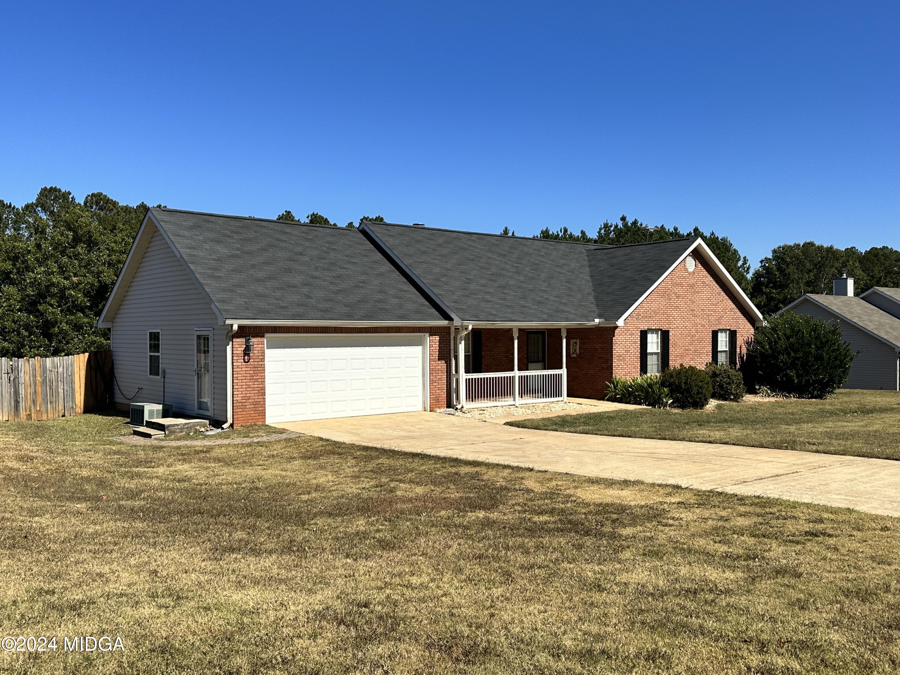 106 Meadow View Drive Jackson, GA 30233 - Photo 39 of 40 a house with yard and a wooden fence